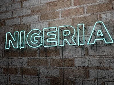 NIGERIA - Glowing Neon Sign on stonework wall (Demo)