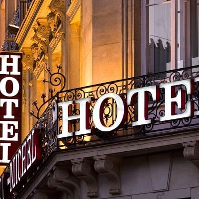 Illuminated Parisian hotel sign taken at dusk (Demo)
